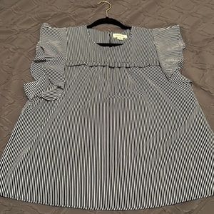 Monteau top with black and white strips with cute ruffles on the sleeves